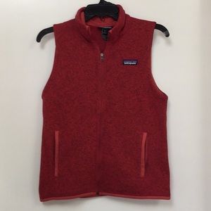 Red fleeced, zipper front vest.